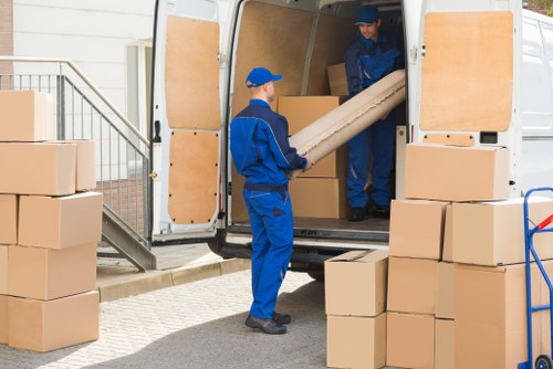 Safe loading of furniture into a van by a moving team