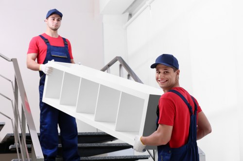 Furniture pick-up team collecting bulky household items in Kingston upon Thames