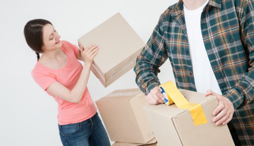 Man with van loading items into vehicle at the start of service terms page