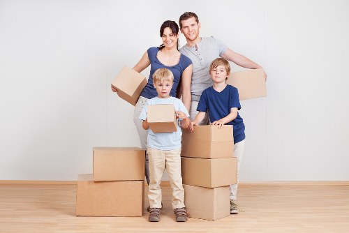 Removal van and movers working in a Kingston upon Thames street
